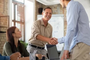 people high five in a office